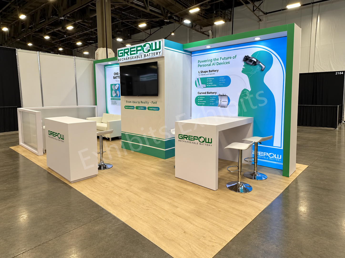 GREPOW booth at CES 2026 with central monitor tower, branded counters and green graphics