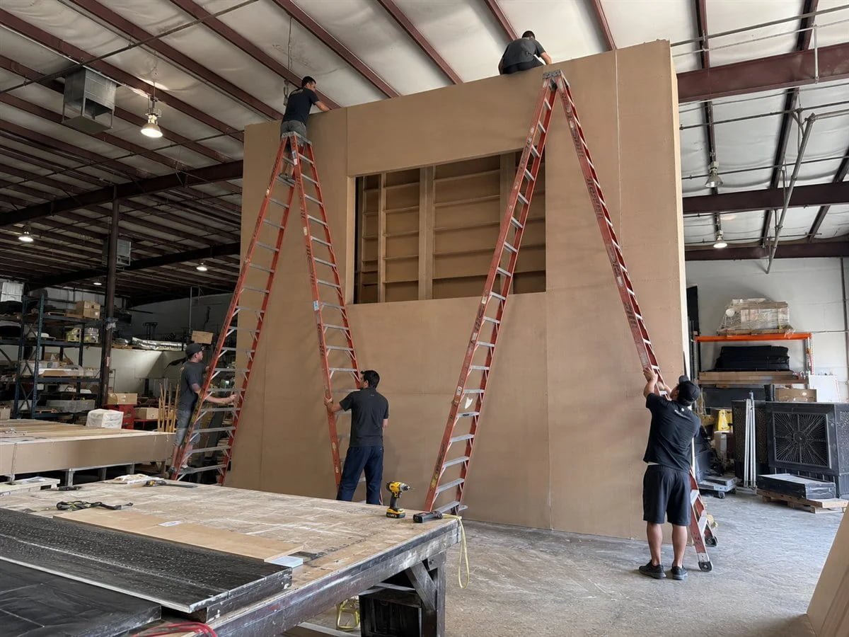 Fabrication specialists assembling custom exhibit structures
