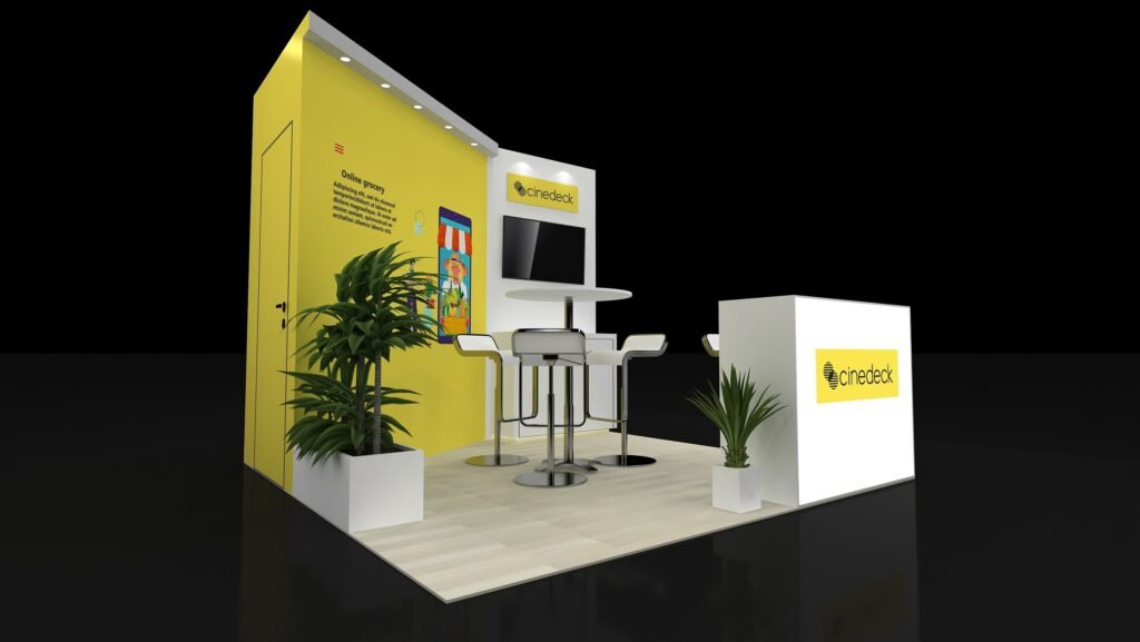 Perspective of EXM-1010-009 showing a yellow graphic backwall, white monitor panel and reception counter